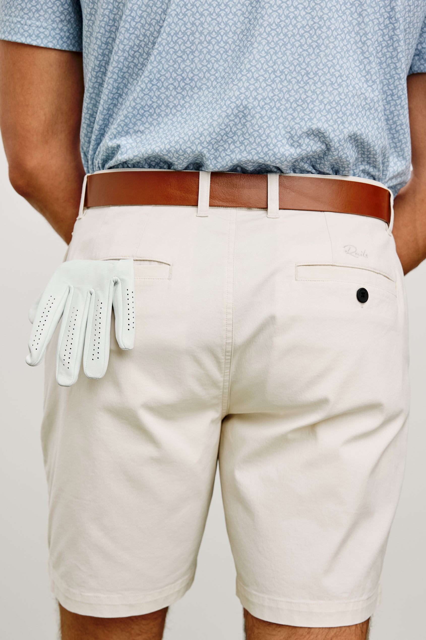 Laguna Mid-Length Short in Light Stretch Cotton With Belt Loops and Side Zip Pockets in Stone Colorway - Lower Body Back View Featured on Model