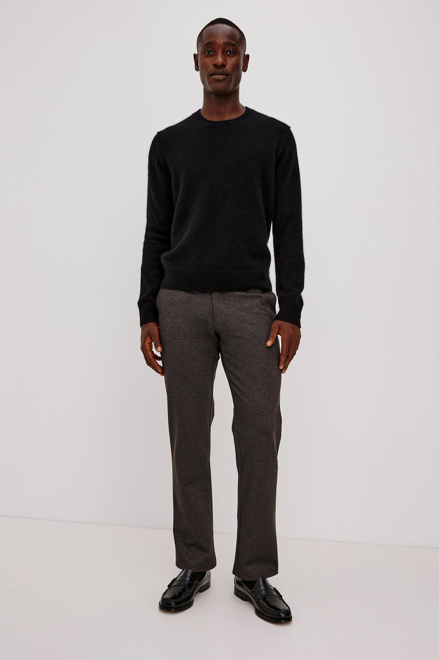 Laurent Sweater in Merino Wool Cashmere Blend With Relaxed Fit, Reversed Linking Seams at Arm Holes, and Long Sleeves in Black Colorway - Full Body Front View Featured on Model