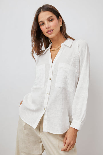 Lauren Long-Sleeve Button Up with Two Chest Patch Pockets and a V Neck in White Colorway - Front View Featured on Model