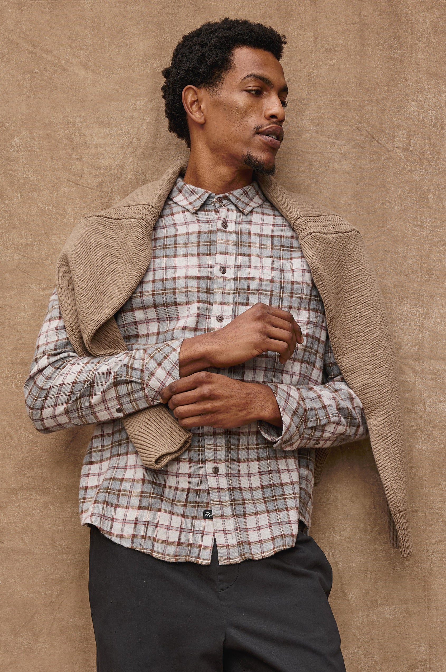 Lennox Long-Sleeve Button Up with a Chest Patch Pocket in Charcoal Autumn Melange Colorway, a plaid in Charcoal, Burnt Orange and White - Front View Featured on model