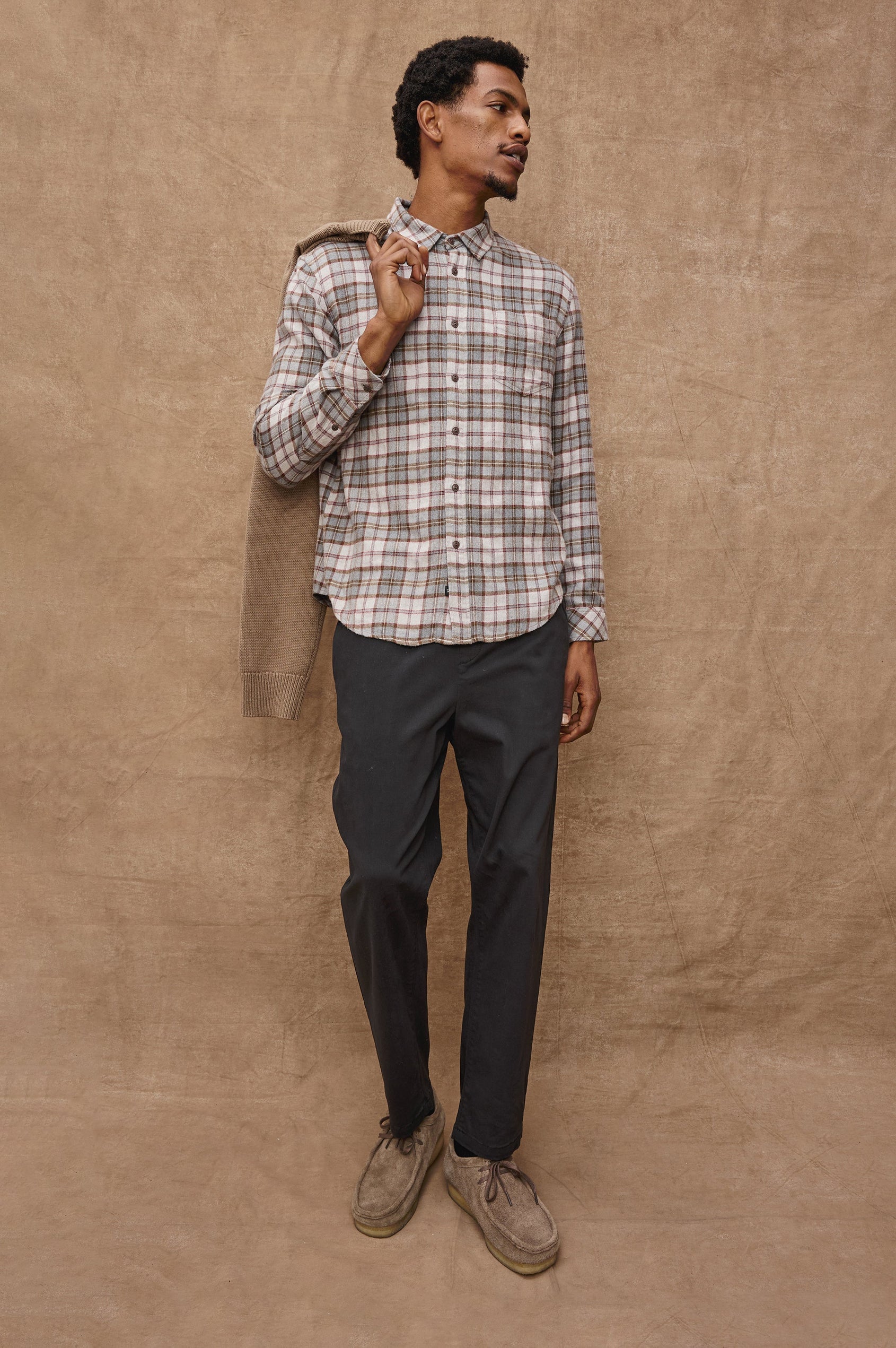 Lennox Long-Sleeve Button Up with a Chest Patch Pocket in Charcoal Autumn Melange Colorway, a plaid in Charcoal, Burnt Orange and White - Front Full Body View Featured on model.