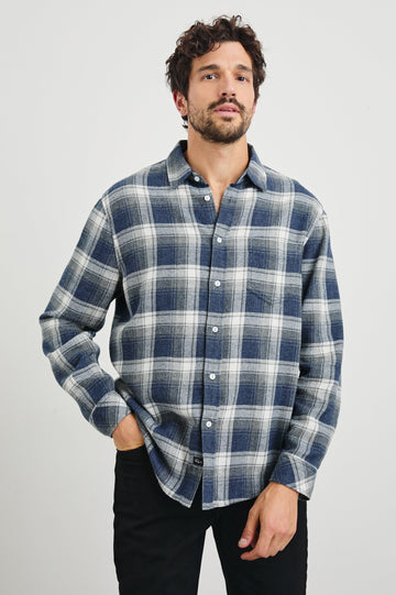 Lennox Long-Sleeve Button Up with a Chest Patch Pocket in Charcoal Lapis Colorway, a plaid in Charcoal, Lapis and White - Front View Featured on model