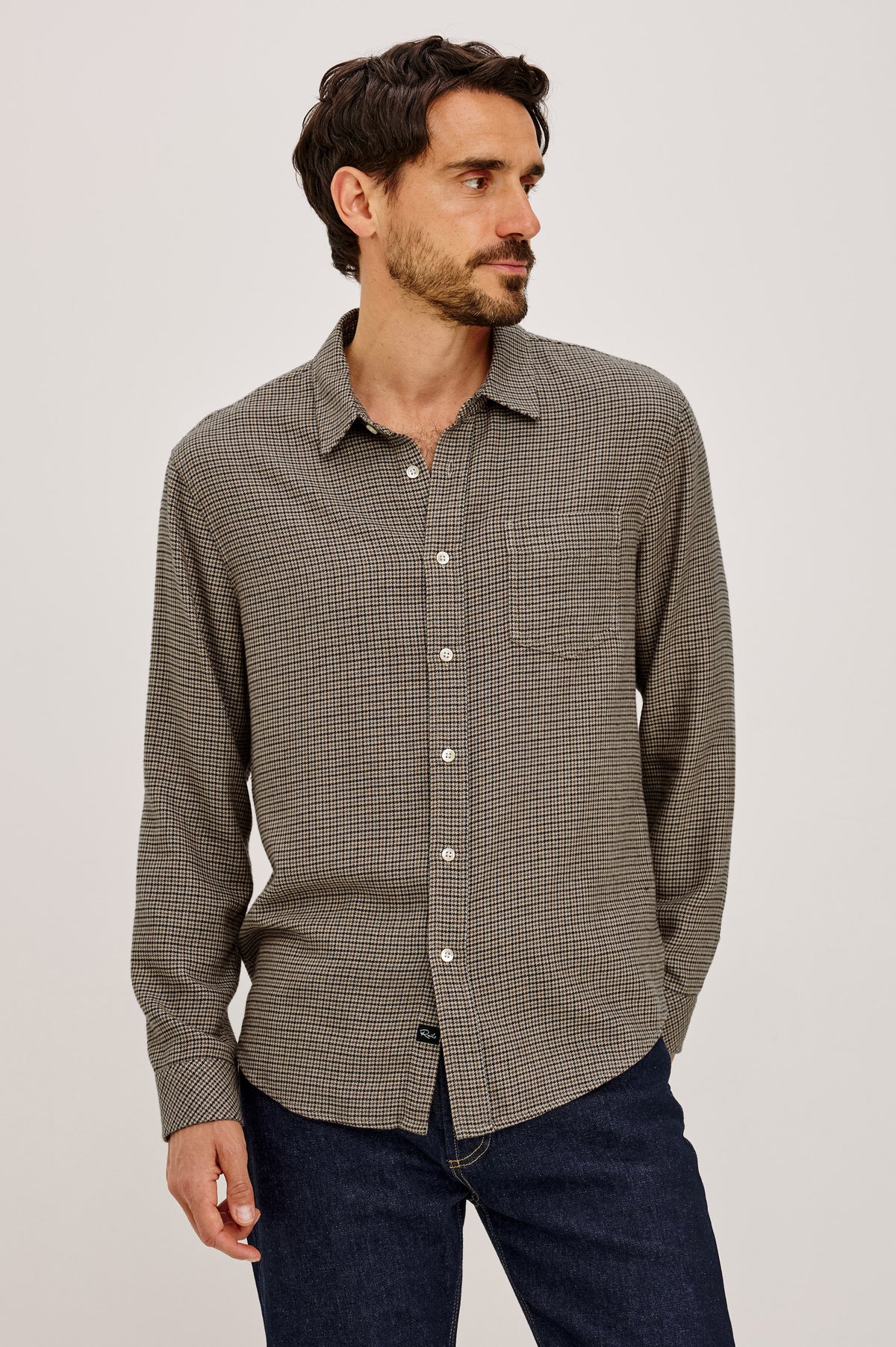 Lennox Shirt in Houndstooth Cotton-Rayon Blend With Front Buttons, Single Chest Pocket, Point Collar, and Long Sleeves in Cotswold Houndstooth Colorway - Front View Featured on Model.
