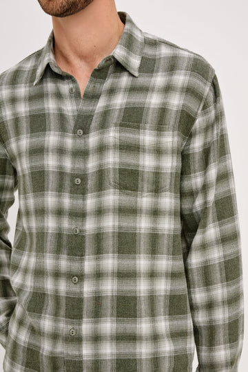 Lennox Long-Sleeve Button Up with a Chest Patch Pocket in Deep Meadow White Colorway, a plaid in Green and White - Front Detail View Featured on Model