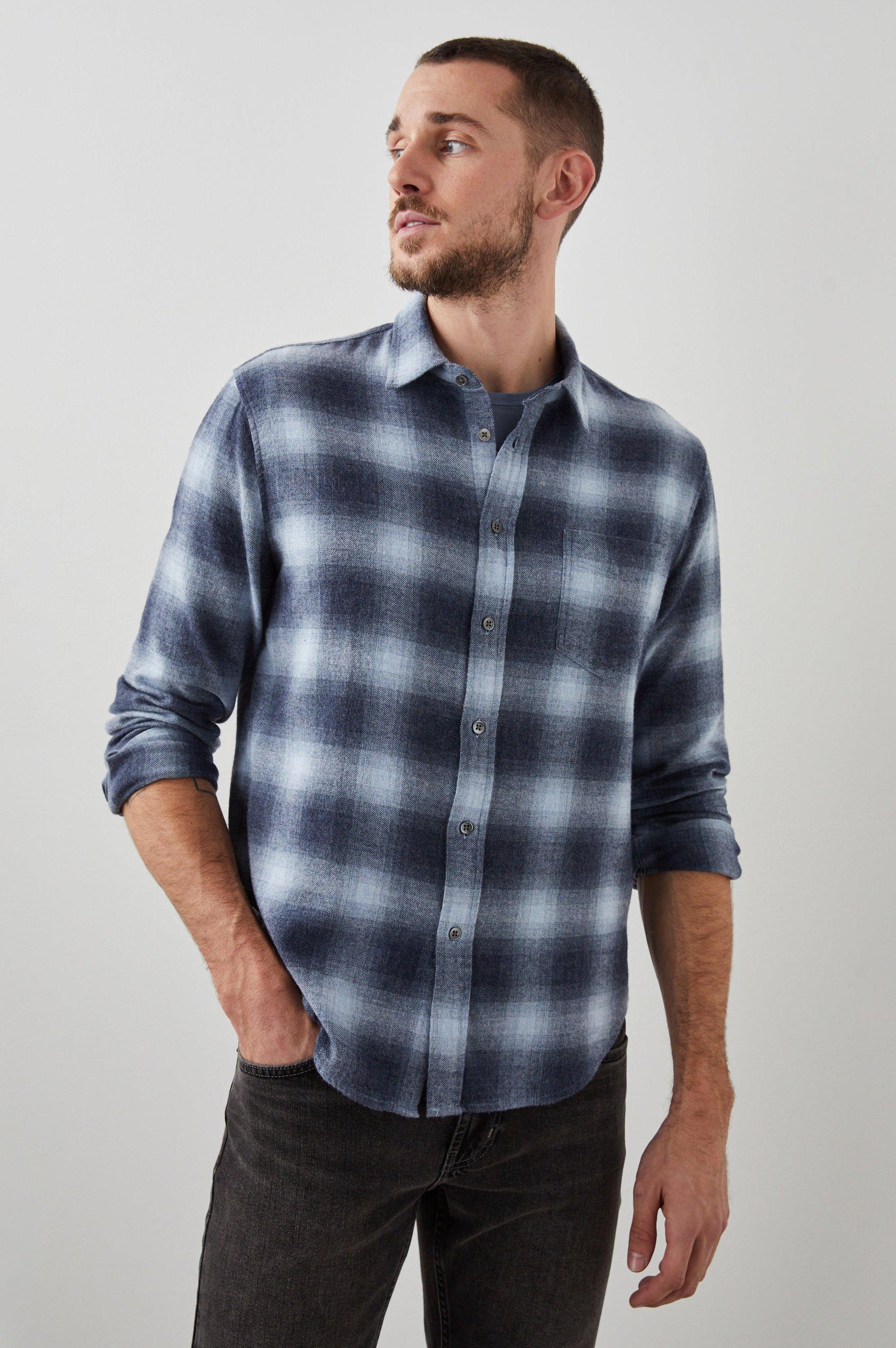 Lennox Long-Sleeve Button Up with a Chest Patch Pocket in Denim Shadow Colorway, a plaid in Denim, Grey and White- Front View Featured on Model