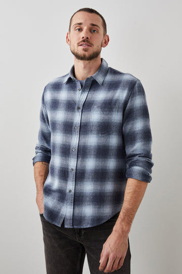 Lennox Long-Sleeve Button Up with a Chest Patch Pocket in Denim Shadow Colorway, a plaid in Denim, Grey and White- Front View Featured on Model