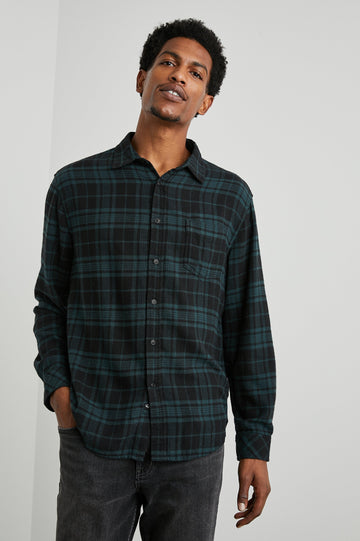 Lennox Long-Sleeve Button Up with a Chest Patch Pocket in Emerald Shadow Colorway, a plaid in Emerald and Black - Front View Featured on Model