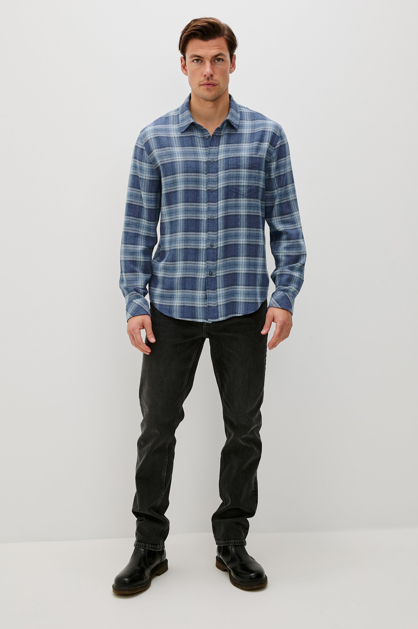 Lennox Long-Sleeve Button Up with a Chest Patch Pocket in Inkwell Melange Colorway, a plaid wtih dark and light blues - Front Full Body View Featured on model