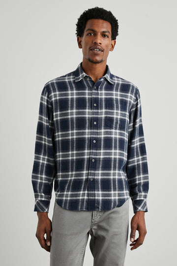 Lennox Long-Sleeve Button Up with a Chest Patch Pocket in Navy Cove Colorway, a plaid in White, Grey and Blue- Front View Featured on Model
