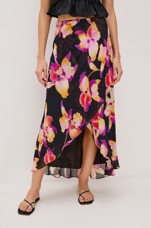 Lenora Cross Front Skirt, High-Low Midi Length, Hidden Elastic Waistband, Lined, in Dusk Orchid Colorway. Front View Shown on Model. 
