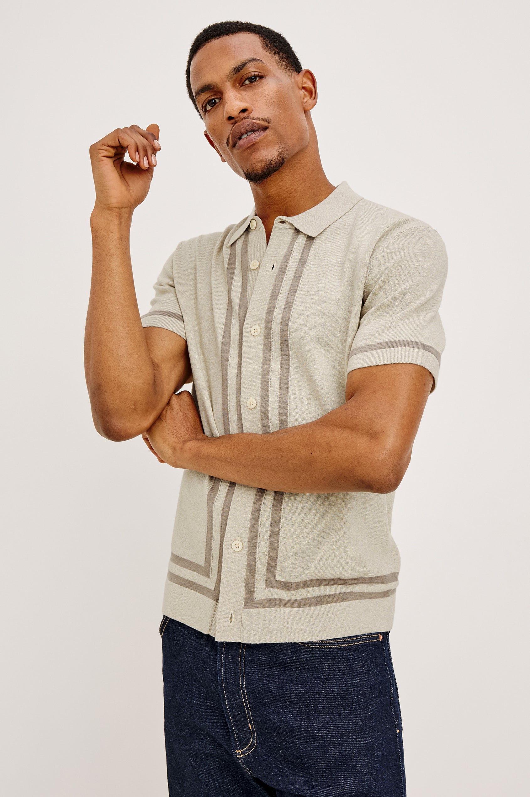 Leo Knit Sweater Polo in Yarn-Dyed Cotton Blend With Collar, Front Buttons, and Short Sleeves in Driftwood Melange Colorway - Front View Featured on Model