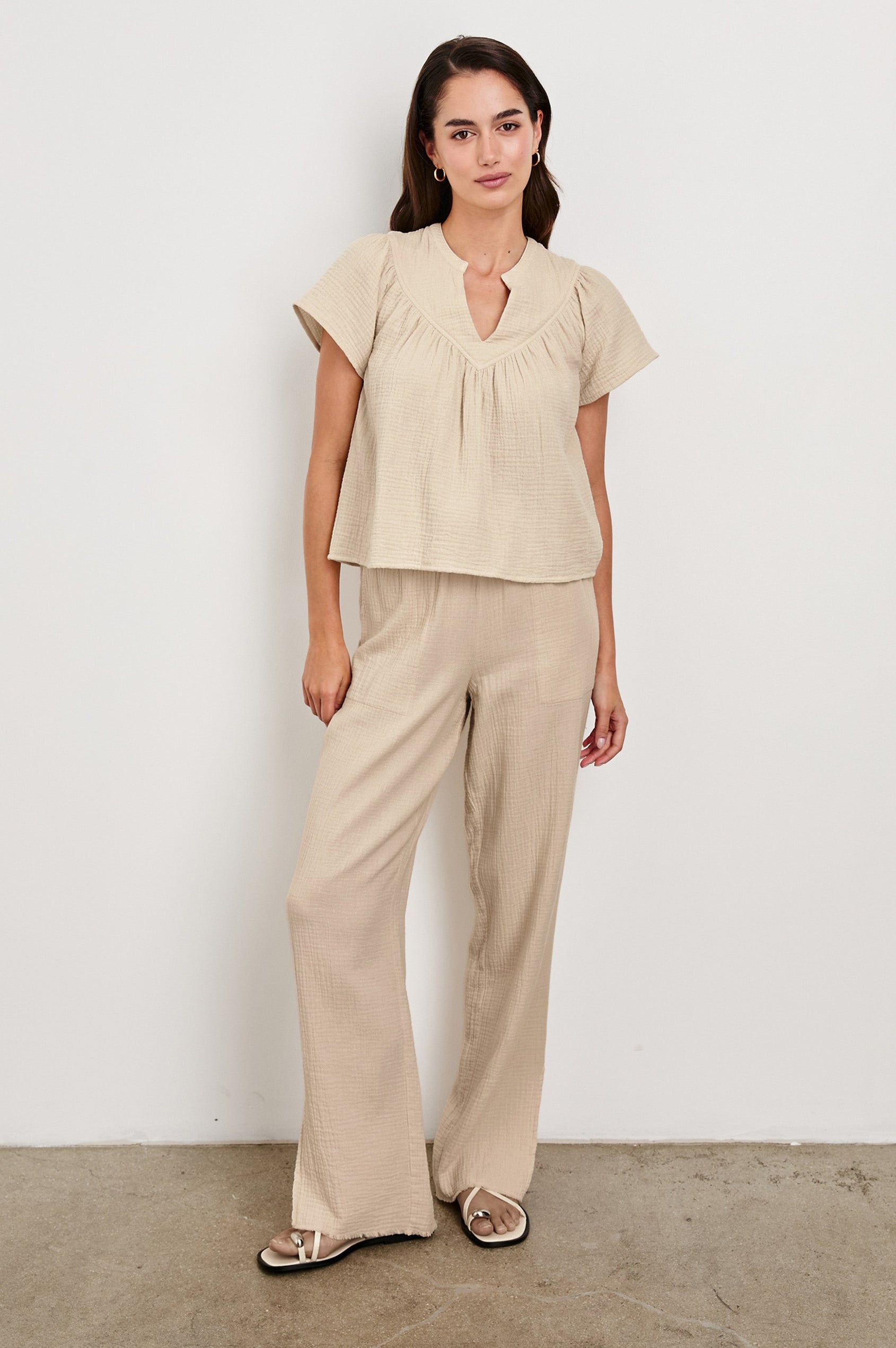 Leon Cotton Gauze Pant With Hemline Slit And Elastic Waist In Colorway Flax -  Full Front Body View Featured On Model