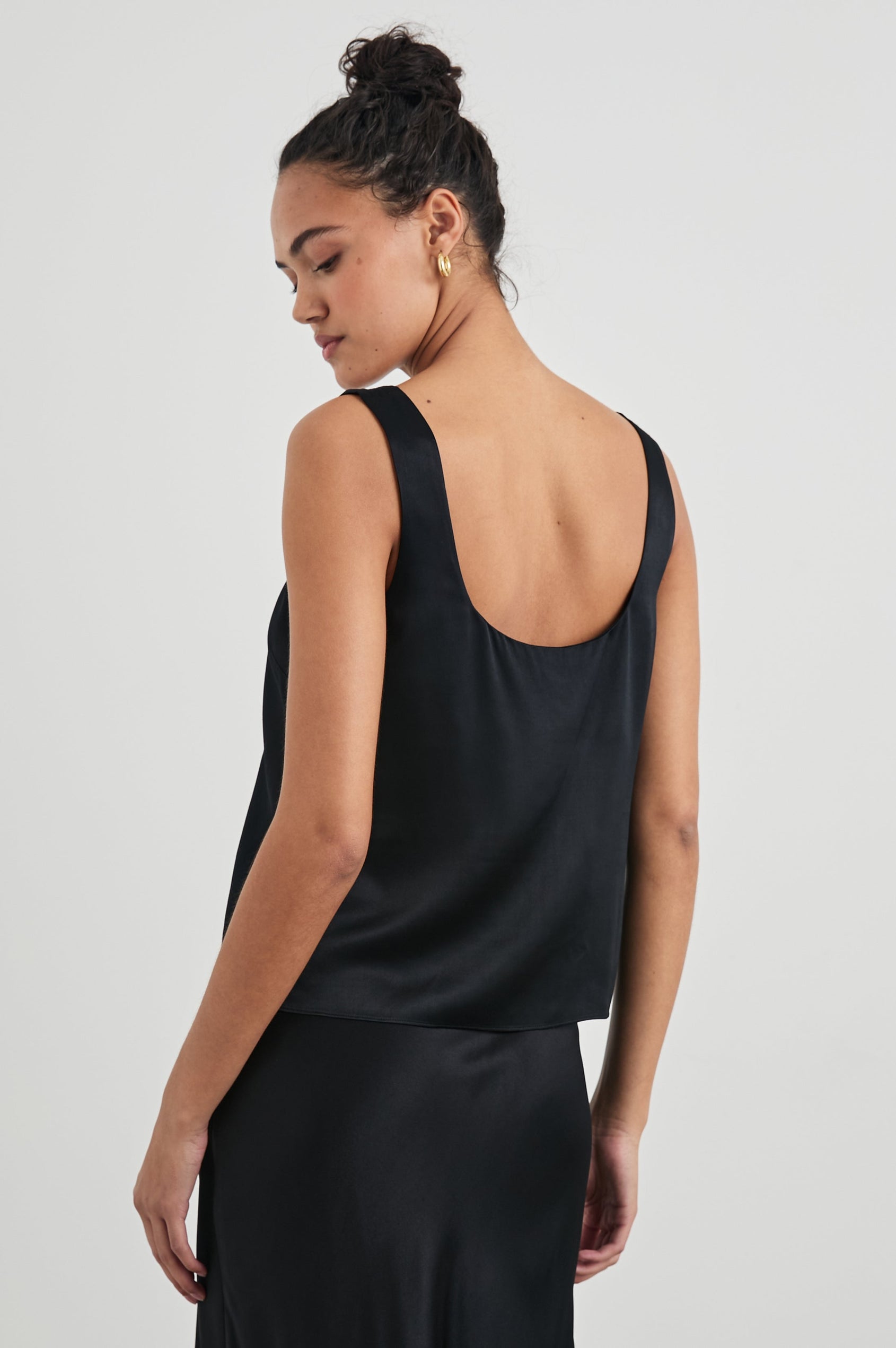 Lexi Tank Top with a Scoop Neck in Black Colorway - Back View Featured on Model 