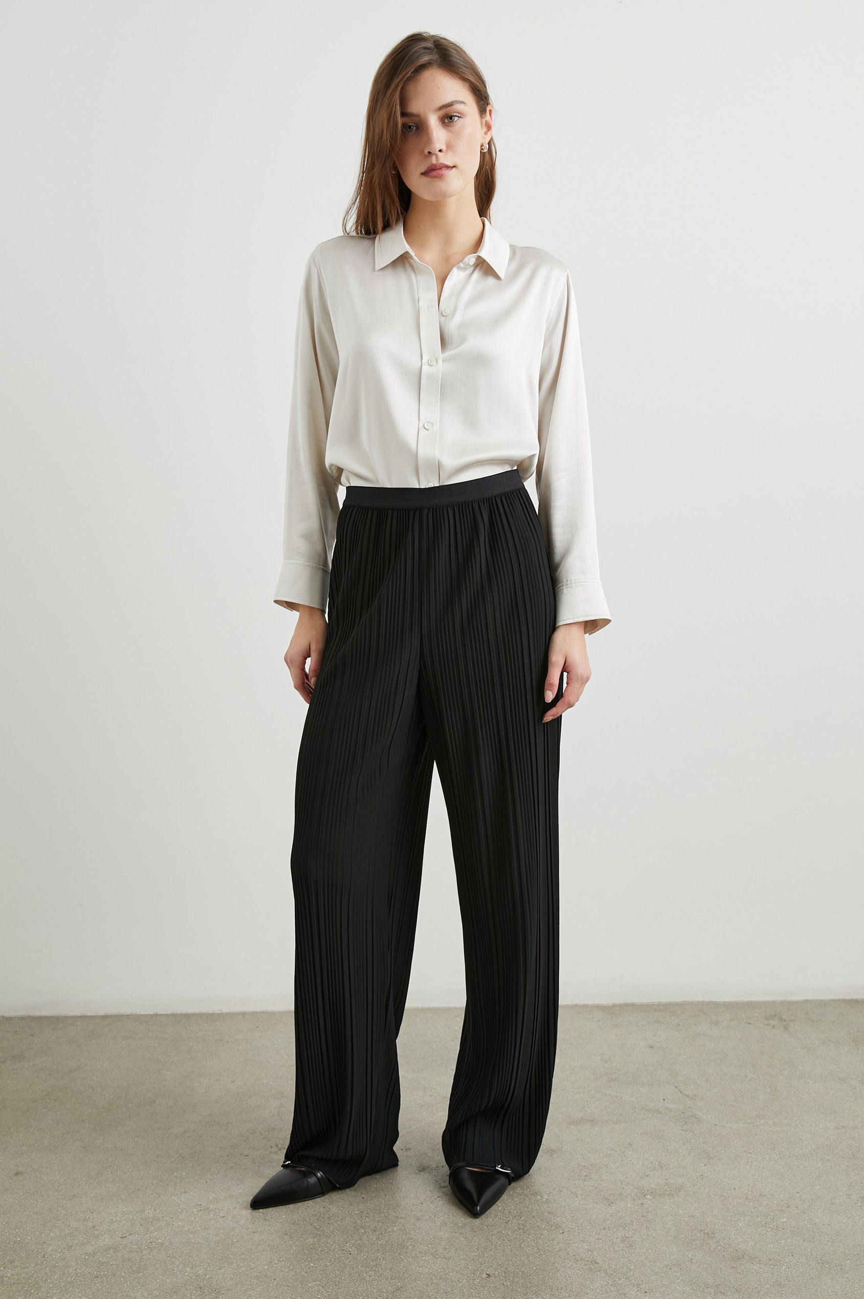 Liana Micro-Pleated Pants with an Elastic Waist in Jet Colorway - Front Full Body View Featured on Model 