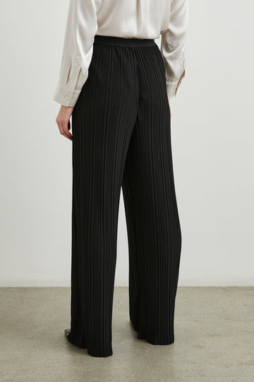 Liana Micro-Pleated Pants with an Elastic Waist in Jet Colorway - Back View Featured on Model 