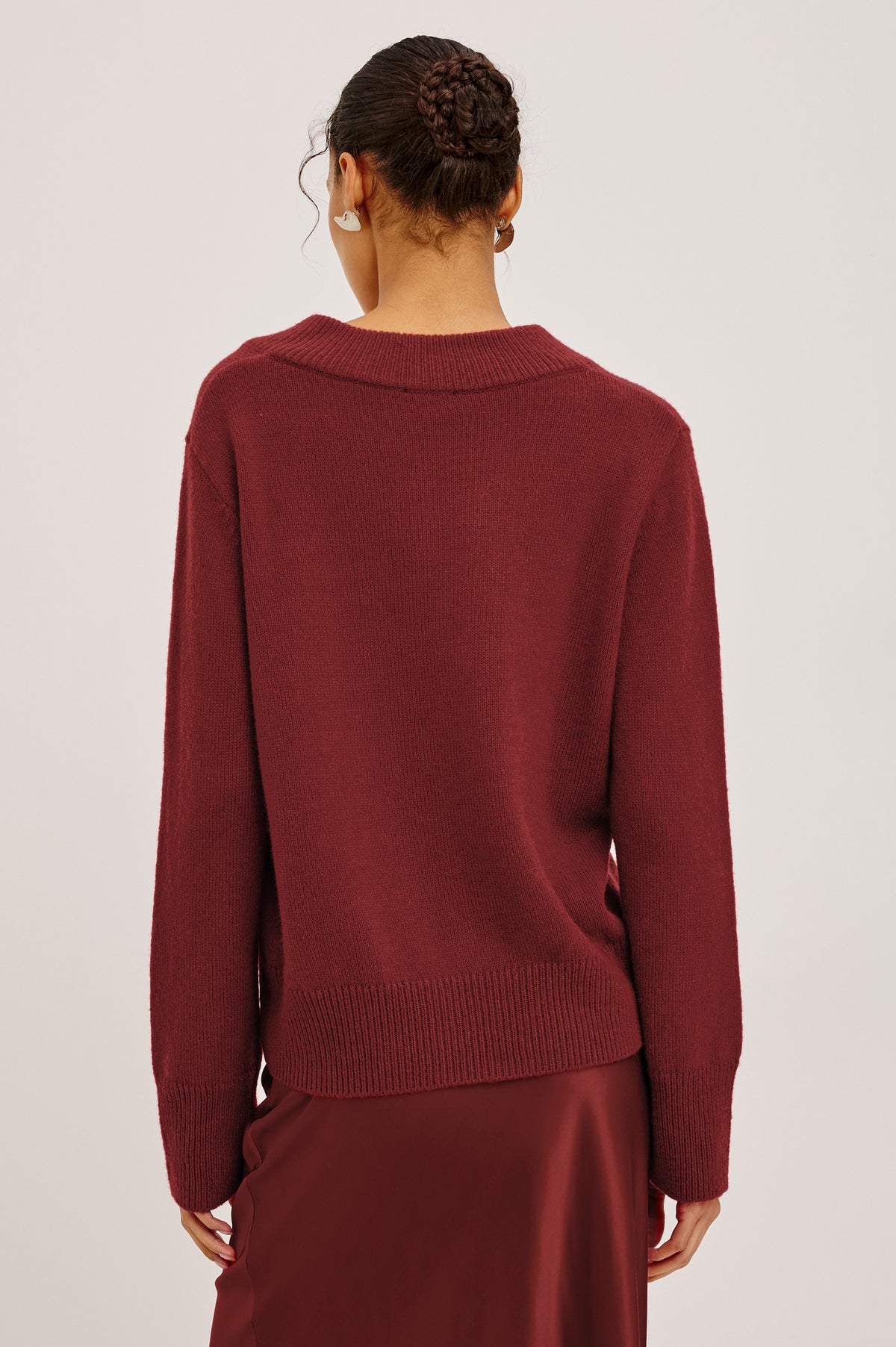 Lidya Sweater in Wool-Cashmere Knit Blend With V-Neckline, Loose Relaxed Fit, Long Sleeves, and Ribbed Trim in Crimson Colorway - Upper Body Back View Featured on Model