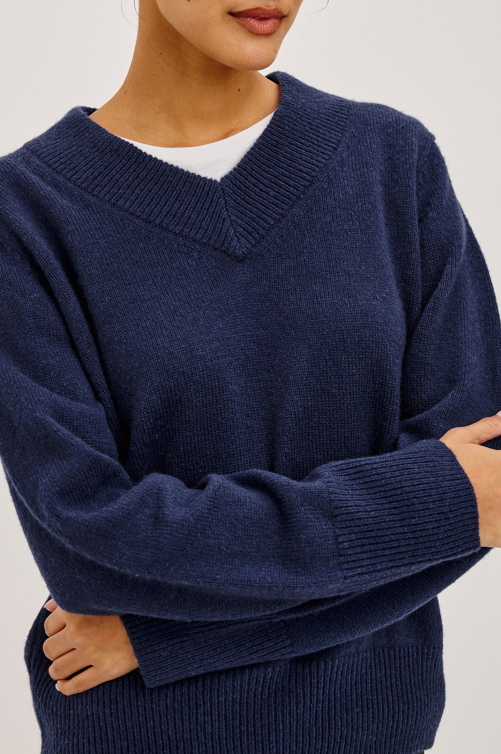 Lidya Sweater in Wool-Cashmere Knit Blend With V-Neckline, Loose Relaxed Fit, Long Sleeves, and Ribbed Trim in Navy Colorway - Upper Body Front View Featured on Model