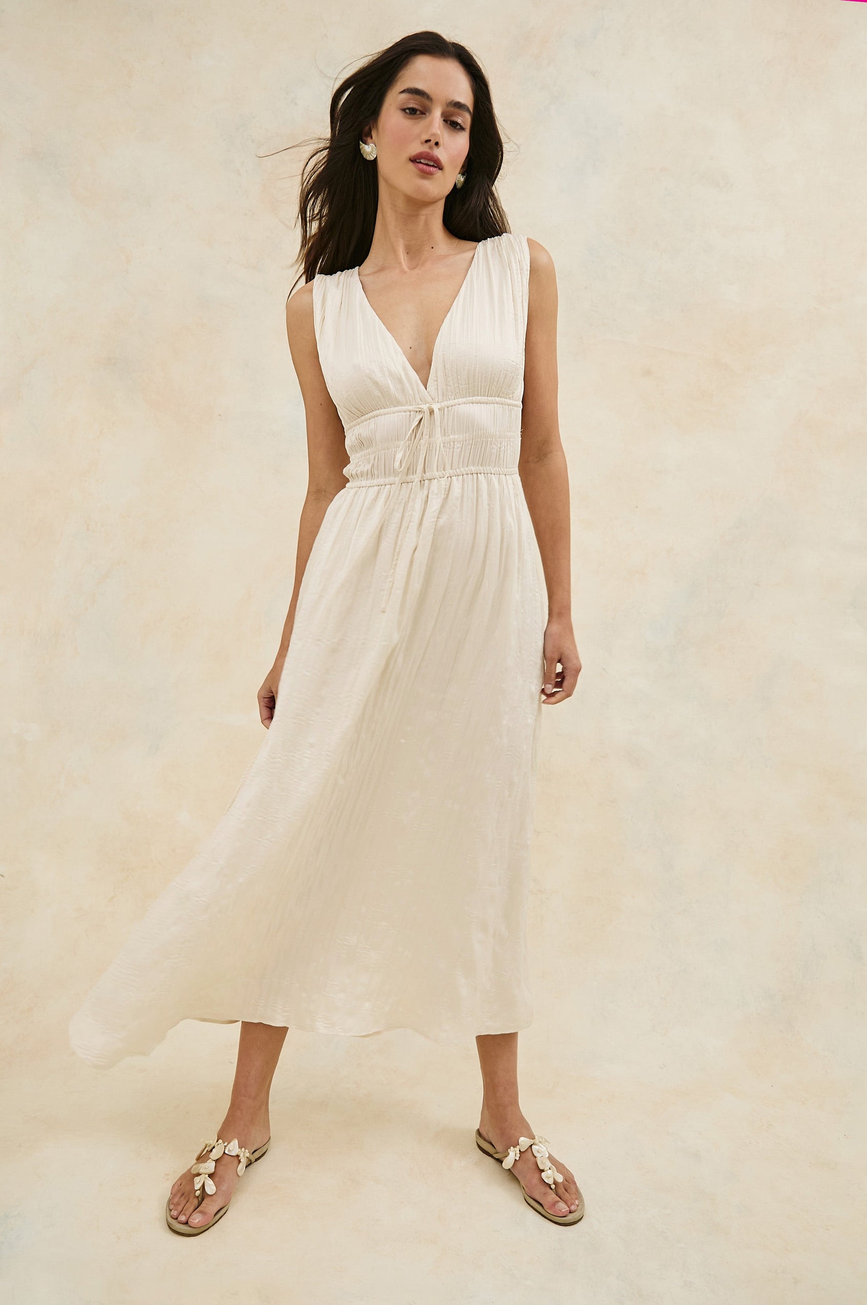 Lilith V-Neck Midi Dress with Drawstring at Under Bust and Gathering Detail at Shoulder Seam and Waist in Ivory Colorway. Full Body Front View Shown on Model.