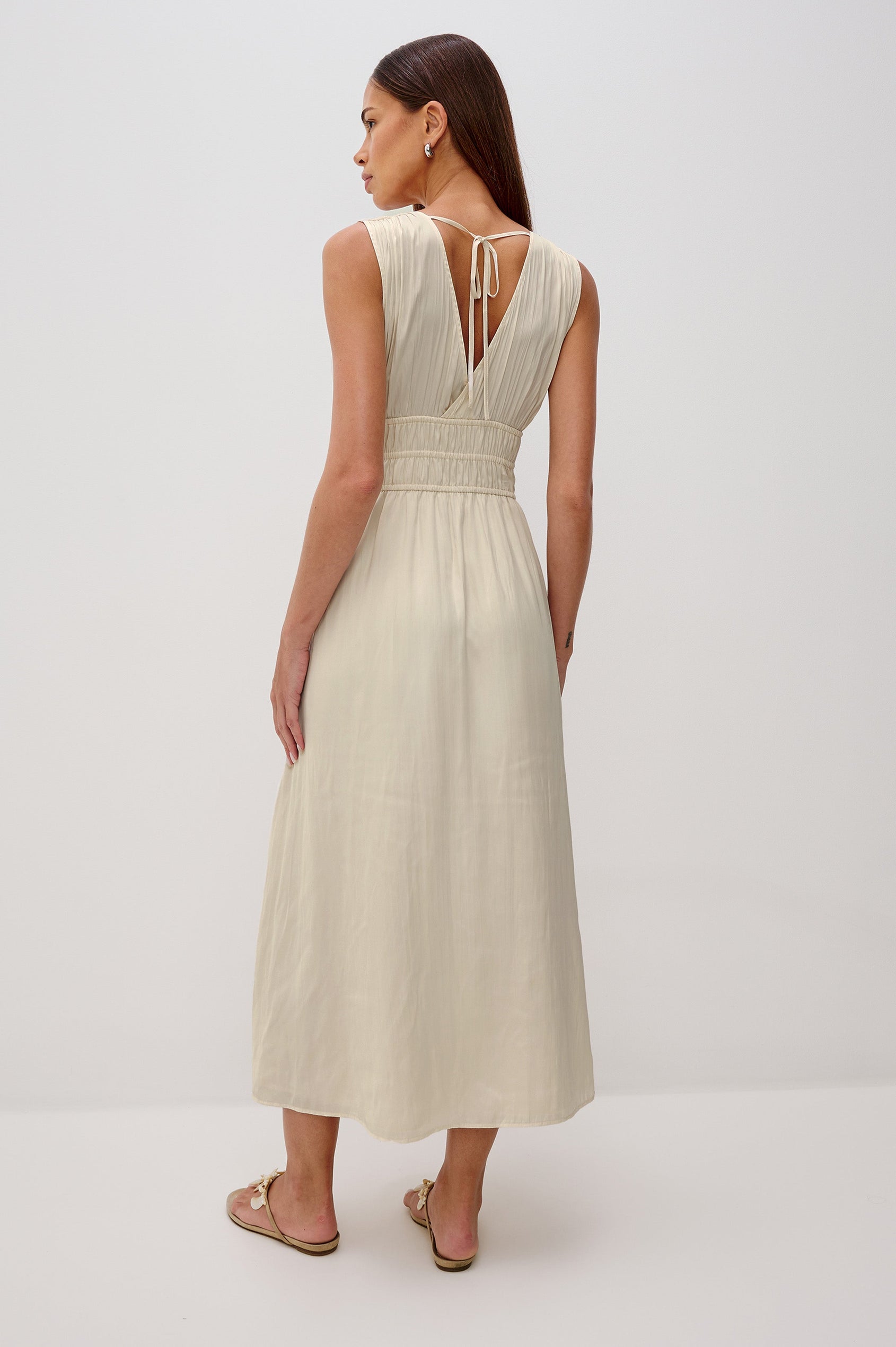 Lilith V-Neck Midi Dress with Drawstring at Under Bust and Gathering Detail at Shoulder Seam and Waist in Ivory Colorway. Full Body Back View Shown on Model.
