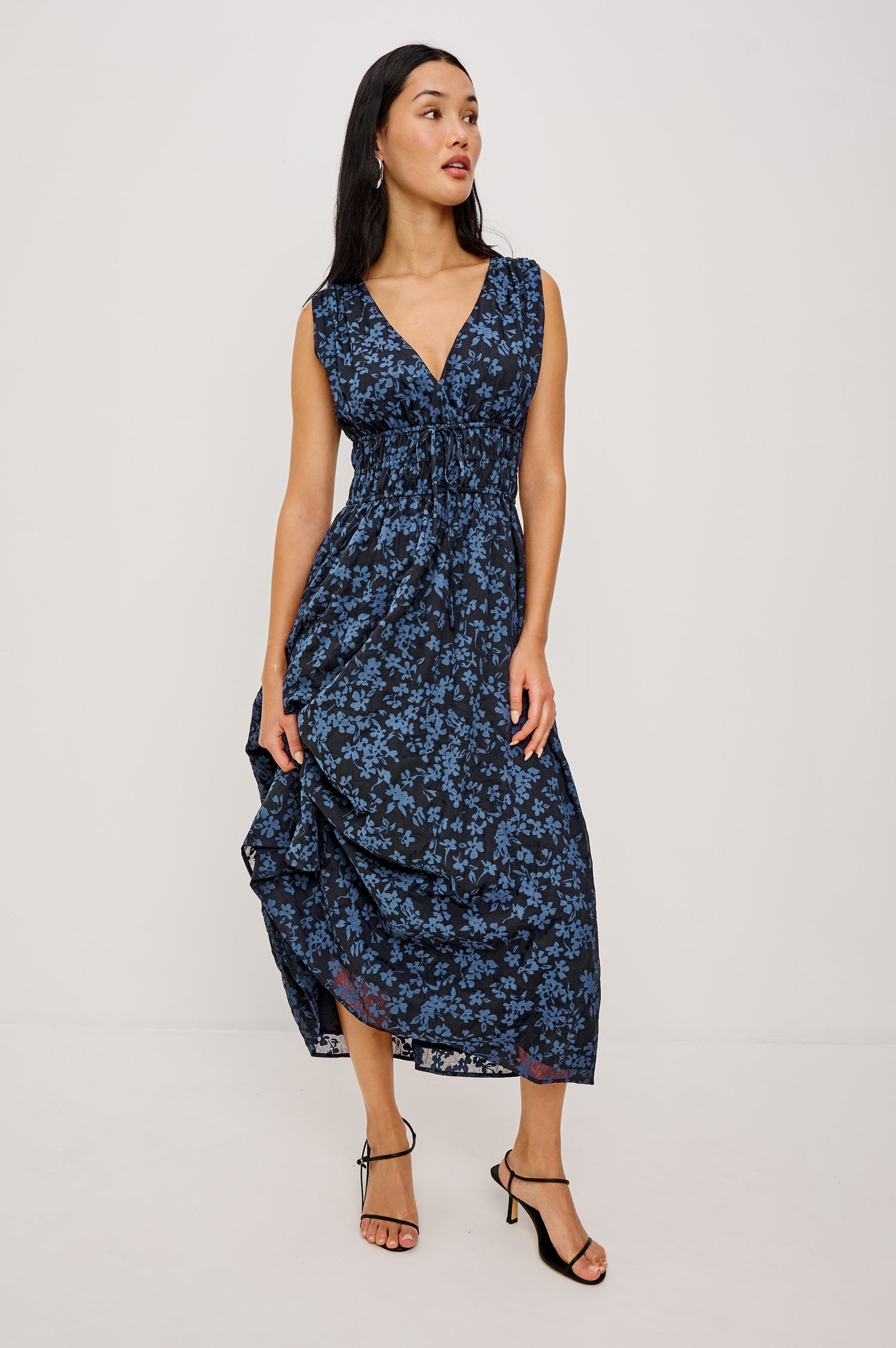 Lilith Midi Dress Crinkle Clip Jacquard With Plunging V-Neckline, Smocked Waist, and Back Ties in Midnight Silhouette Floral Colorway - Full Body Front View Featured on Model