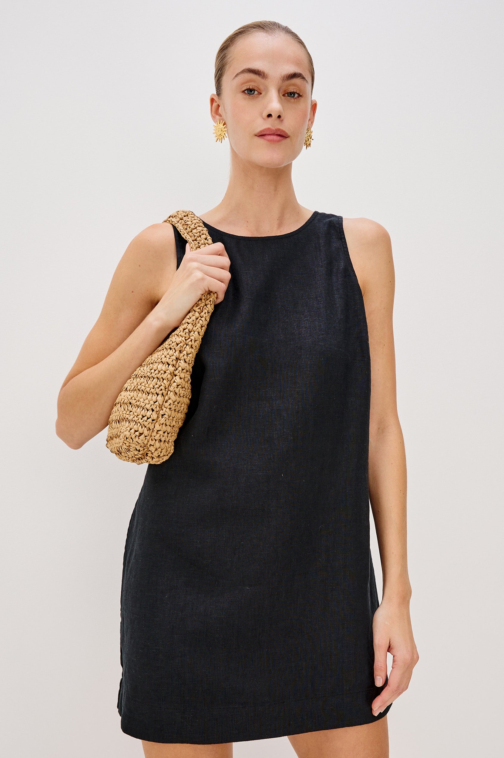 Lindsey Sleeveless Scoop Neck Mini Dress in Black Colorway. Front View Shown on Model.