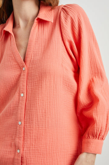 Lo Long-Sleeve Button Up with a V Neck in Papaya Colorway - Front View Featured on Model