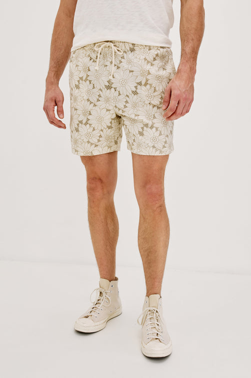 Logan Swim Short with a Drawstring Waistband and Side Pockets in Multi Blue Sunflower Colorway. Front View Shown on Model.