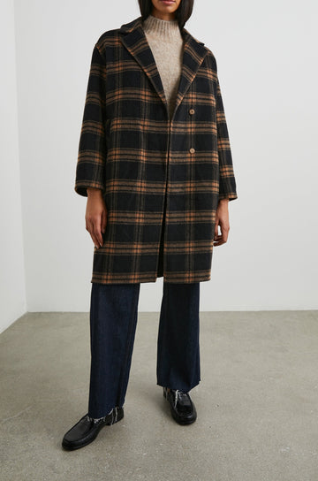 Lore Knee-Length Coat with Two Button Closure, Notched Lapels and Two Front Pockets in Camel Jet Colorway, a Plaid - Front Full Body View Featured on Model