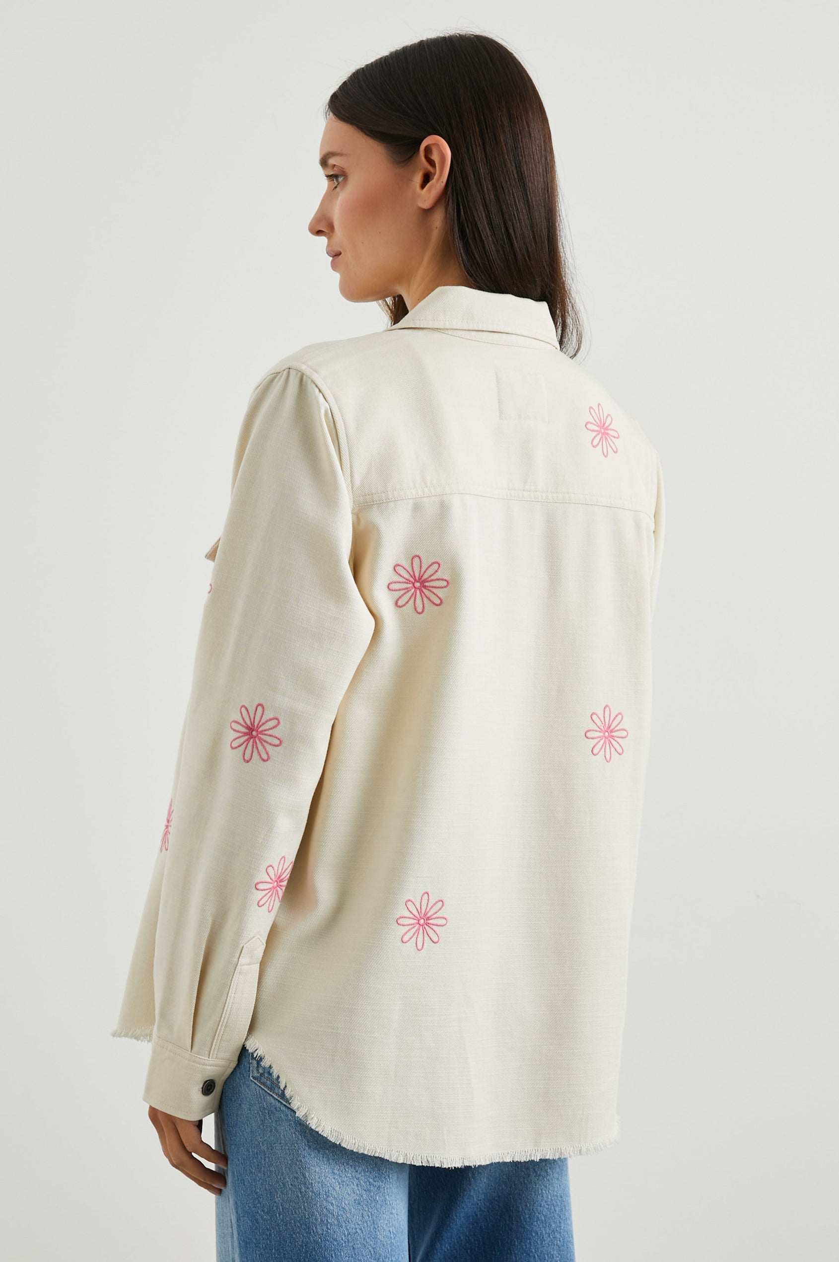 Loren Long-Sleeve Shirt Jacket with Button Closure, Two Chest Button Flap Pockets and a Raw Hem in Ecru Colorway, with Pink Flowers - Back View Featured on Model