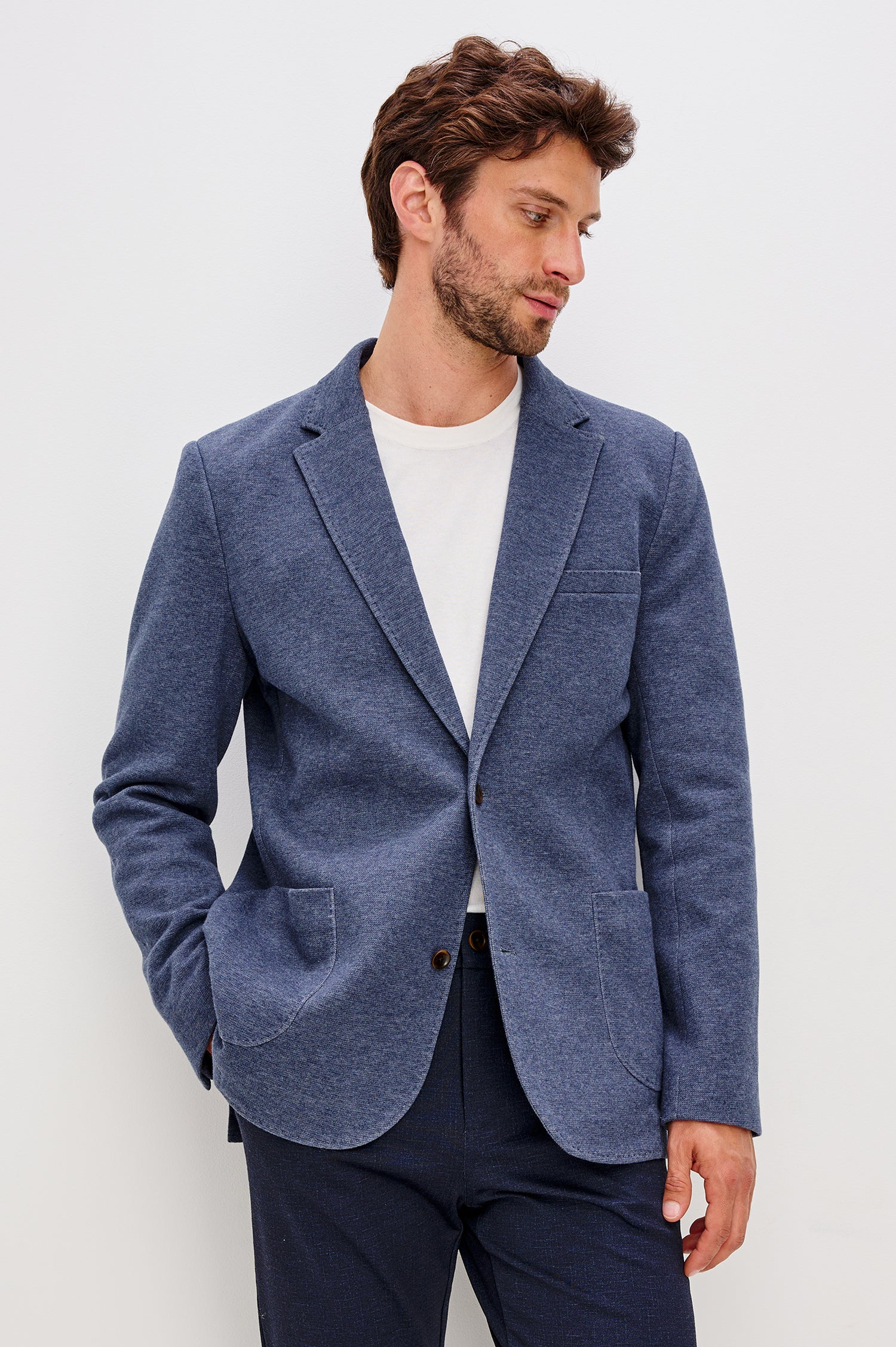 Lorenz Blazer in Nylon With Single Breasted Front Buttons, Single Chest Patch Pocket, Side Patch Pockets, and Long Sleeves in Navy Heather Colorway - Upper Body Front View Featured on Model