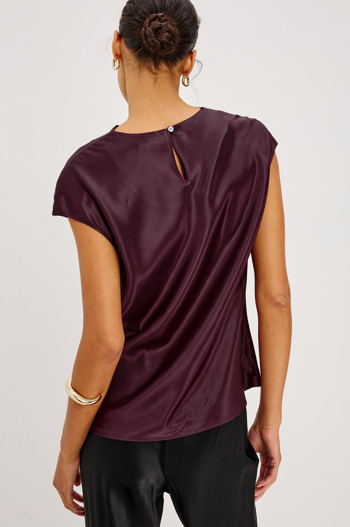 Loretta Top in Satin-Back Crepe With Cap Sleeve, Mock Neckline, Straight Hem, Keyhole Back, and Button-and-Loop Closure in Wine Colorway - Back Crop View Featured on Model.