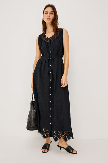 Lorina Midi Dress in Cotton Voile With Lattice and Floral Embroidery, Sleeveless Cut, and Adjustable Waist Ties in Black Colorway - Full Body Front View Featured on Model
