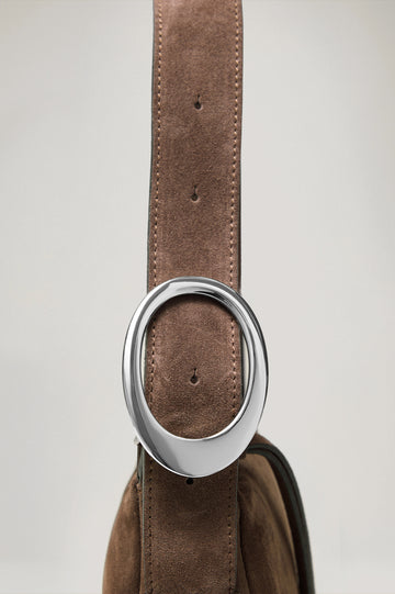 Lucca Shoulder Bag in Suede With Adjustable Strap and Polished Silver Buckle, Microsuede Lining, and Snap Button Interior Slip Pocket in Espresso Suede Colorway - Side View Close Up Featured