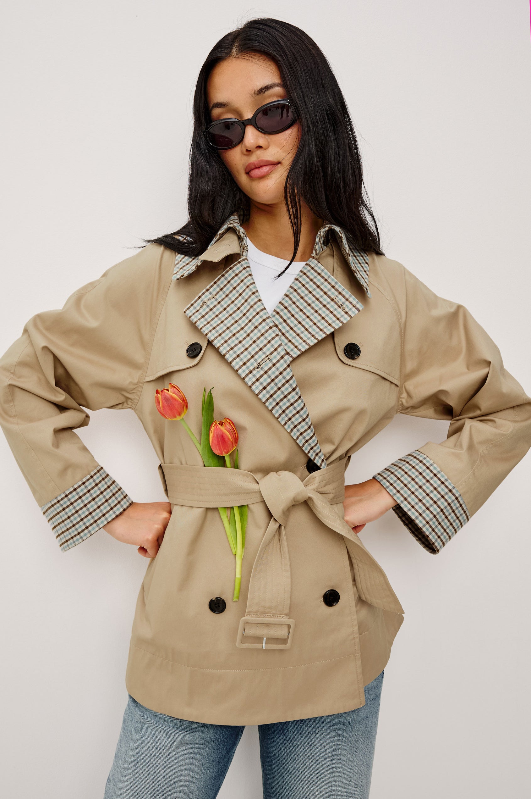 Lucien Trench Jacket in Garbardine With Notched Lapels, Wide 3/4 Sleeves, Double Breasted Buttons, Adjustable Belt, and Contrast Lining in Sand - Upper Body Front View Featured on Model