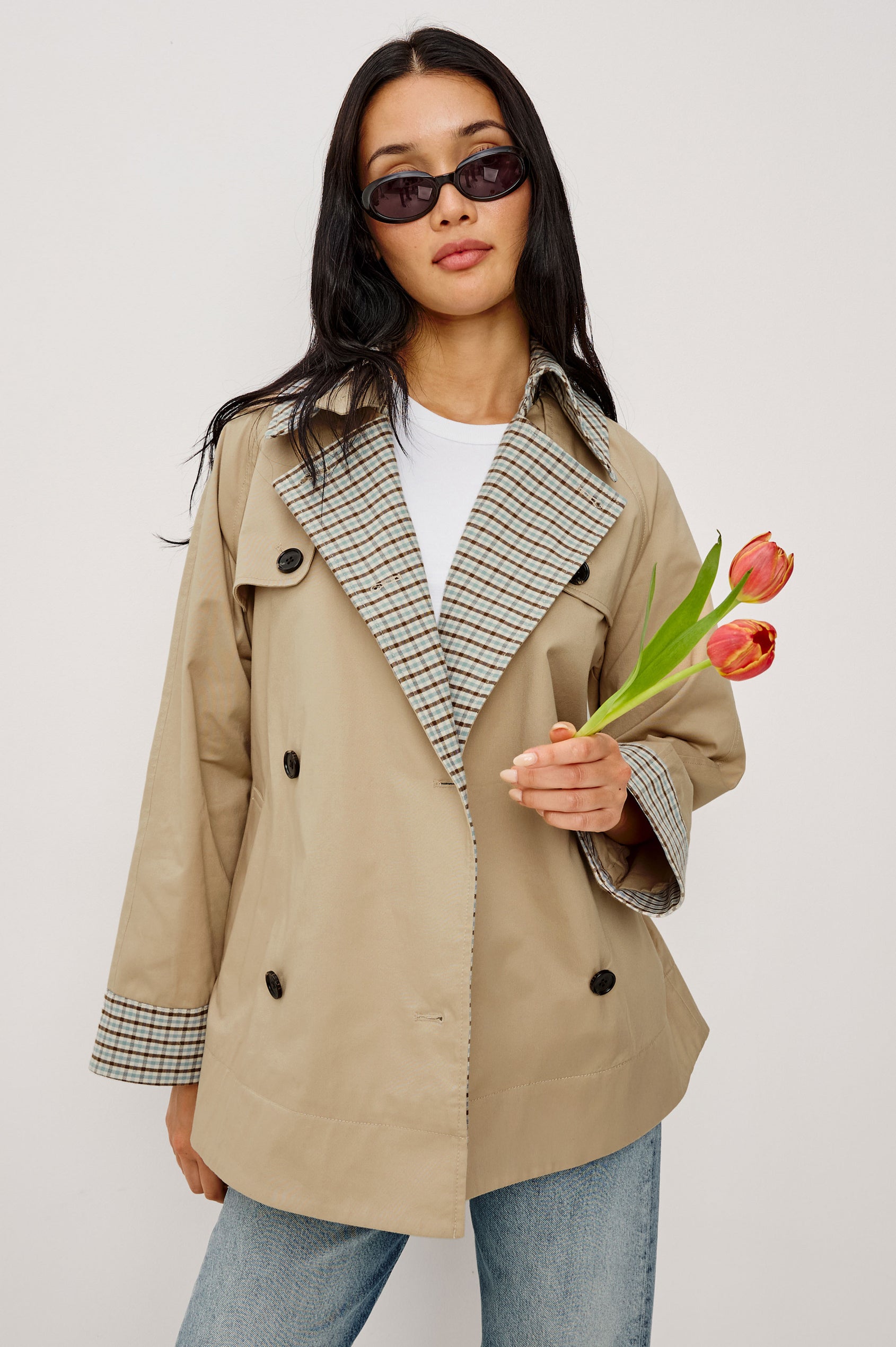 Lucien Trench Jacket in Garbardine With Notched Lapels, Wide 3/4 Sleeves, Double Breasted Buttons, Adjustable Belt, and Contrast Lining in Sand - Upper Body Front View Featured on Model