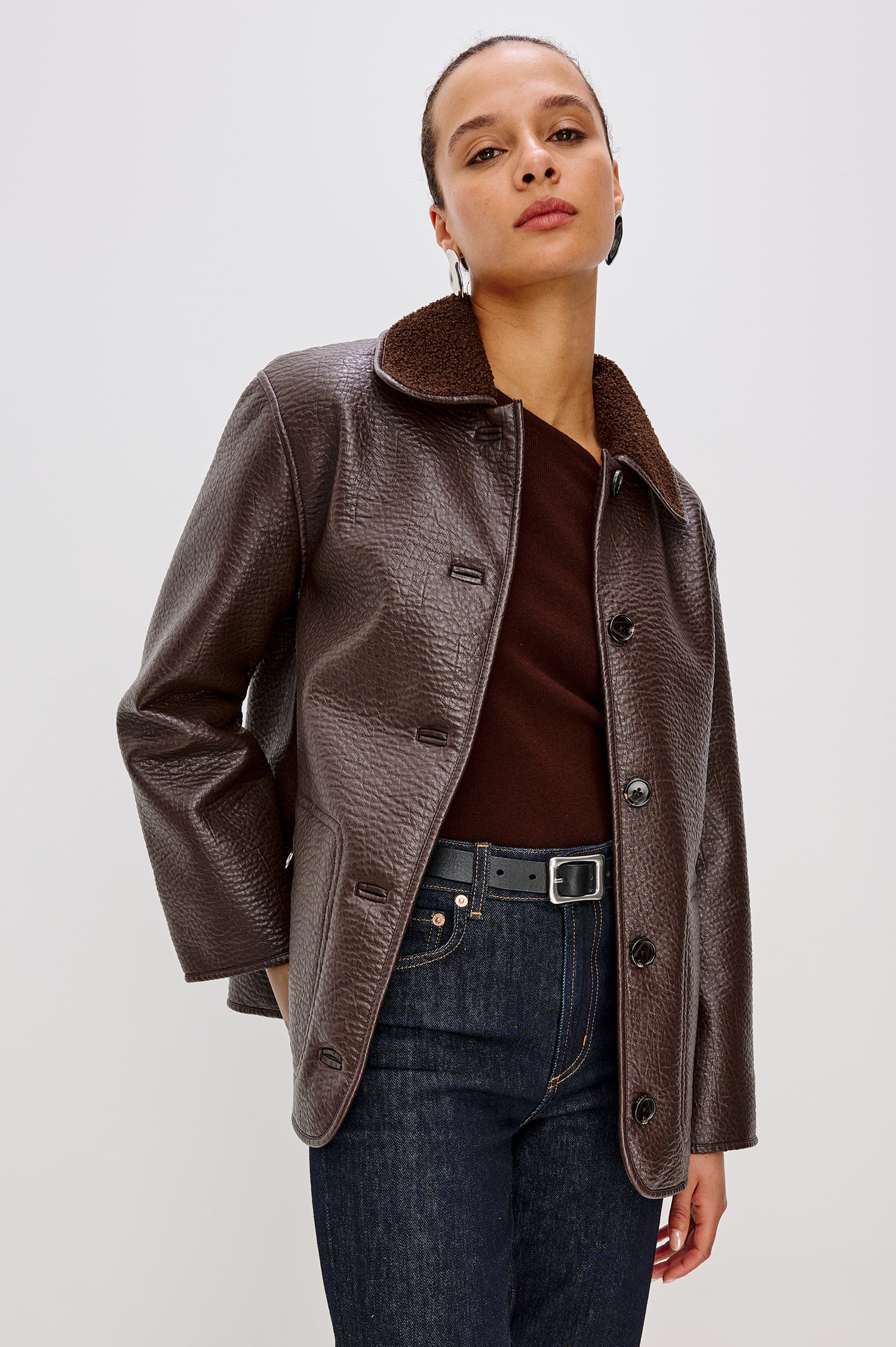 Leah Jacket in Vegan Pebbled Leather With Plush Faux Shearling Collar and Lining, Front Buttons, Zippered Side Pockets With O-Ring Pulls in Walnut Colorway - Upper Body Front View Featured on Model
