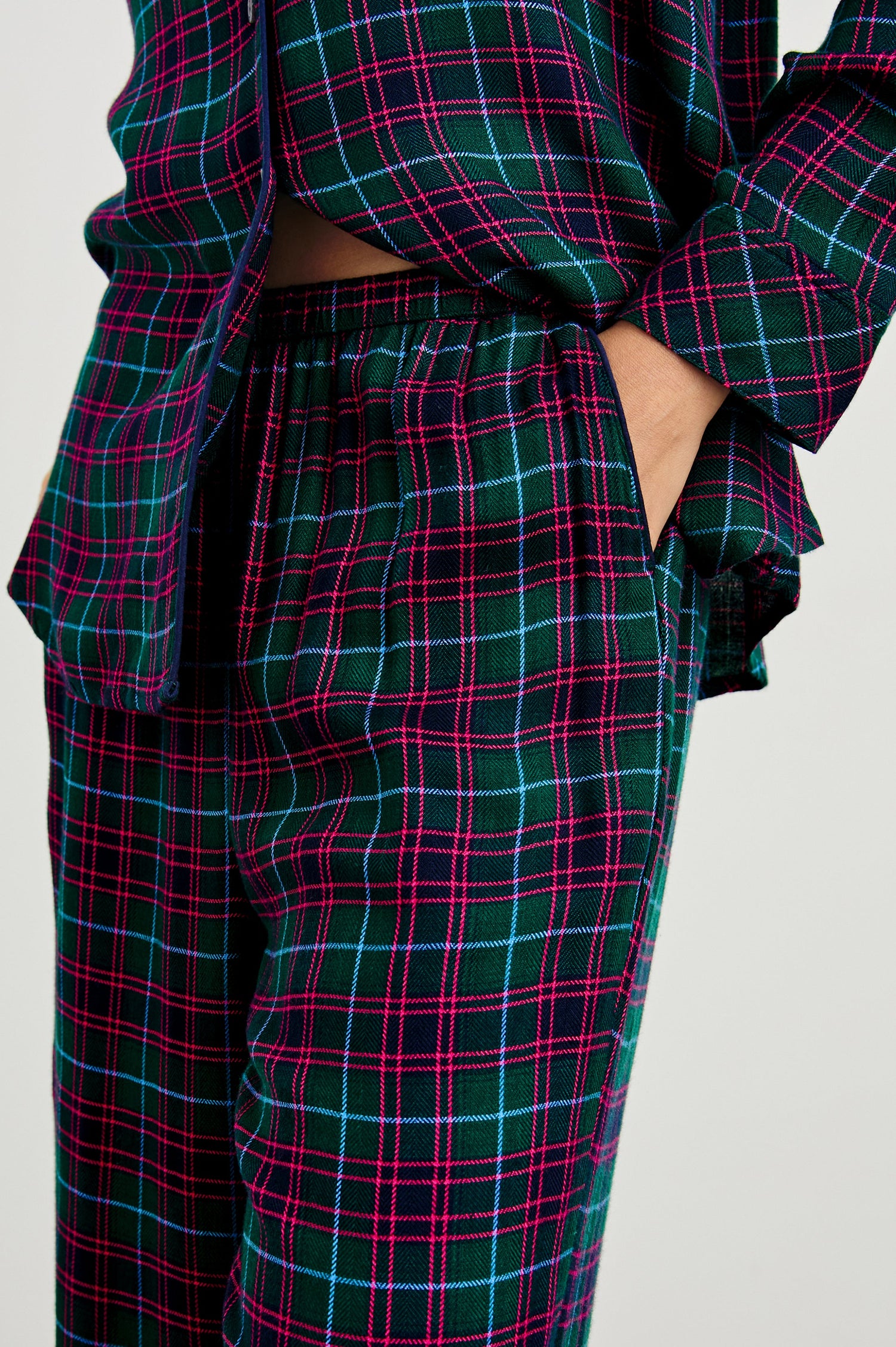 Luna Pajama Set with a Long Sleeve, Button Up, V Neck Top with a Chest Patch Pocket and Pants with Two Front Pockets in Evergreen Fuchsia Ice Colorway, a plaid - Front View Featured on Model  