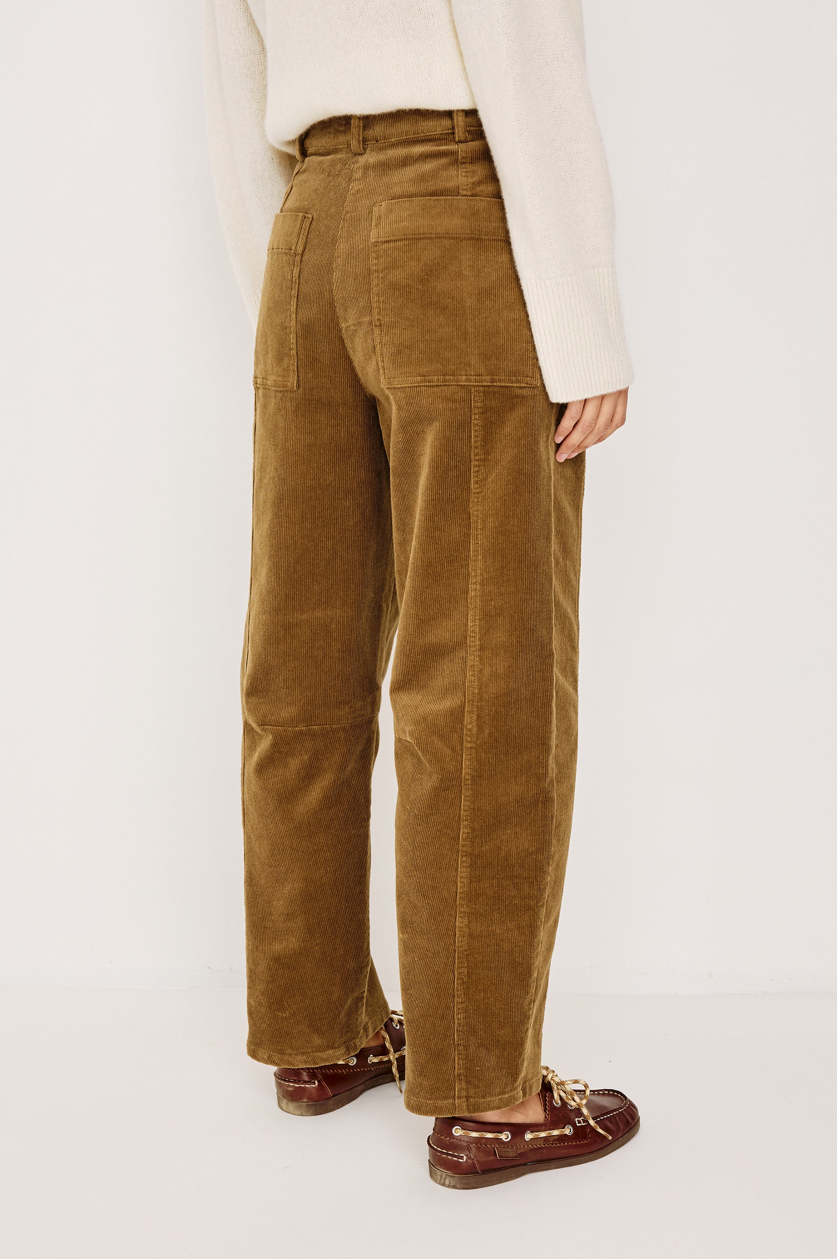 Lunar Pant in Stretch Corduroy With Relaxed Straight Legs, Zip-Fly Closure, Belt Loops, Seam Detailing, Carpenter-Style Side Pockets, and Back Pockets in Ginger Colorway - Lower Body Back View Featured on Model