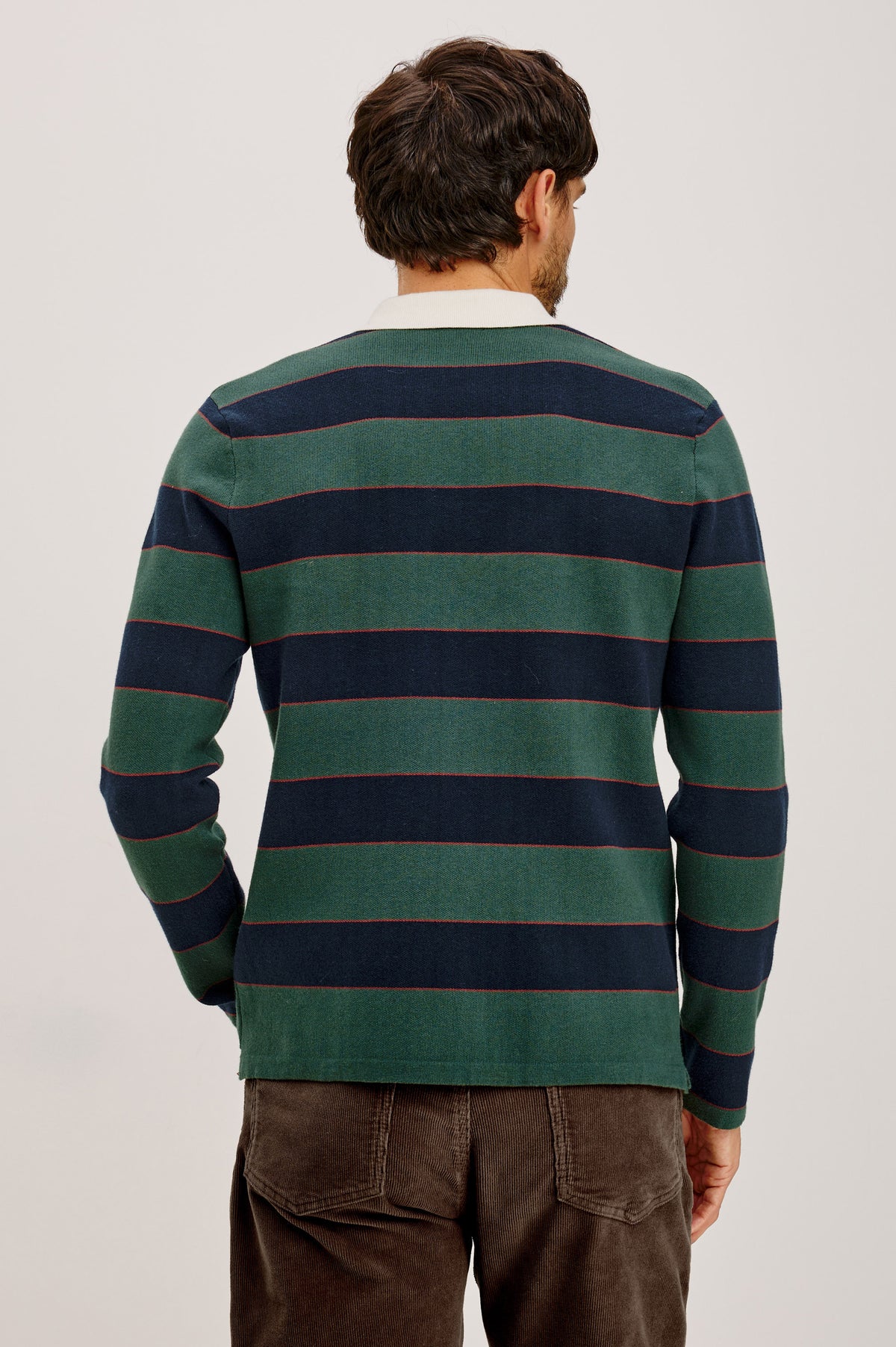 Luther Sweater in Striped Knit With Contrast Collar, Quarter-Button Placket, and Long Sleeves in Tartan Border Stripe Colorway - Upper Body Back View Featured on Model.