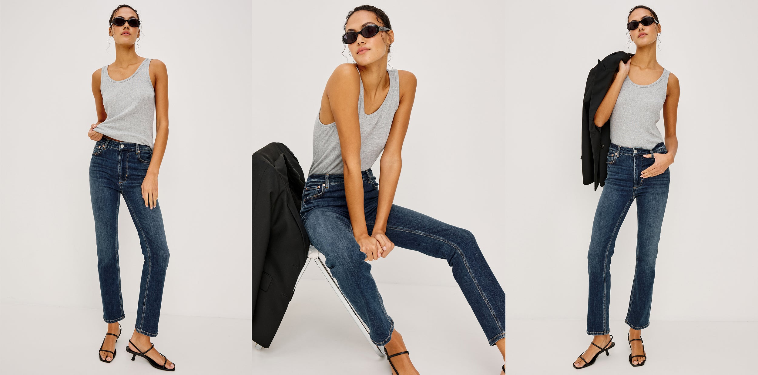 Woman wearing a gray tank top and blue jeans with sunglasses on a white background