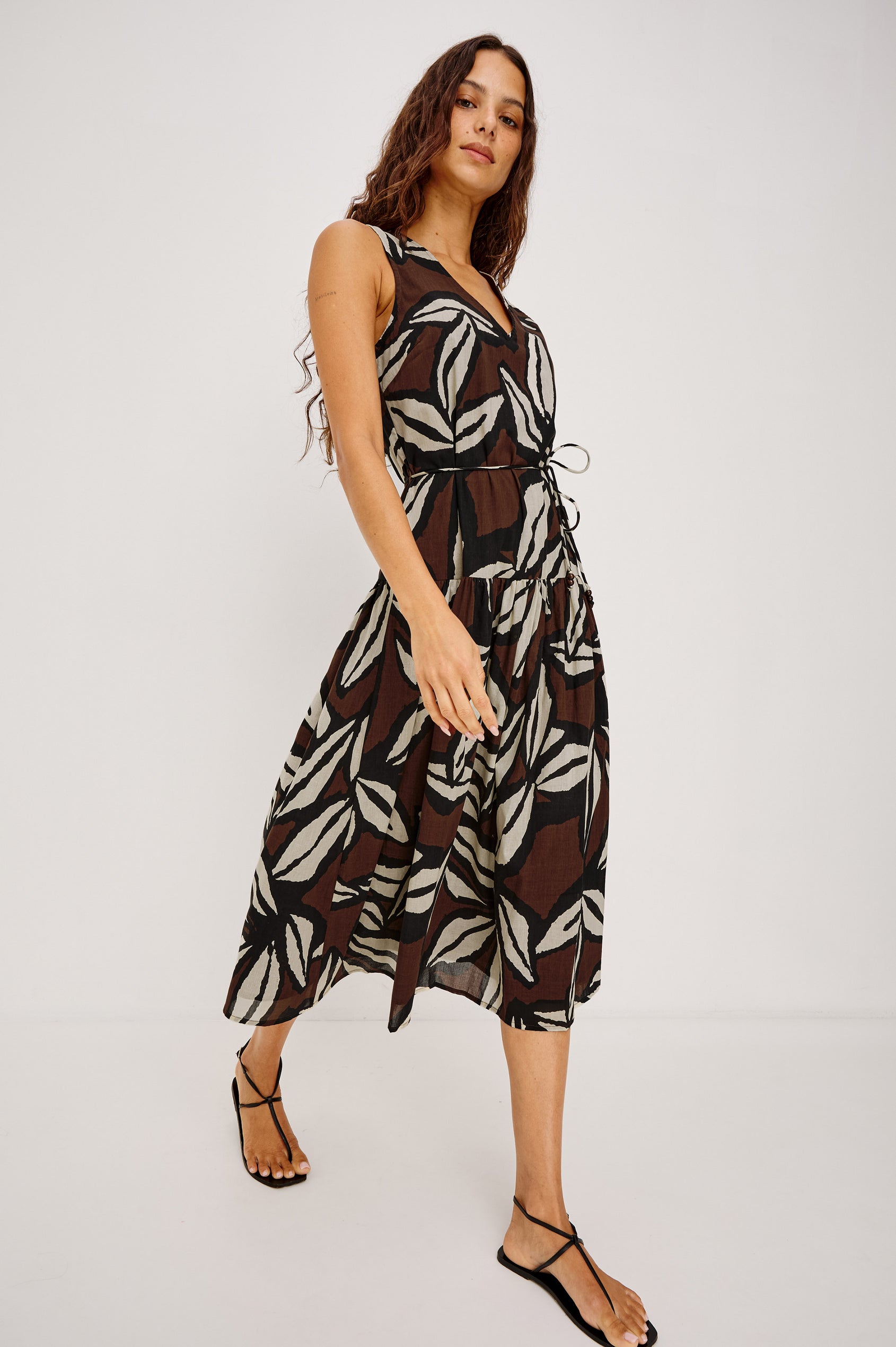 Maeve Midi Dress in Cotton Voile With V-Neckline, Adjustable Belted Ties, A-Line Silhouette, Drop Waist, Tiered Skirt, and Side Seam Zipper in Cocoa Floral Colorway - Full Body Front View Featured on Model
