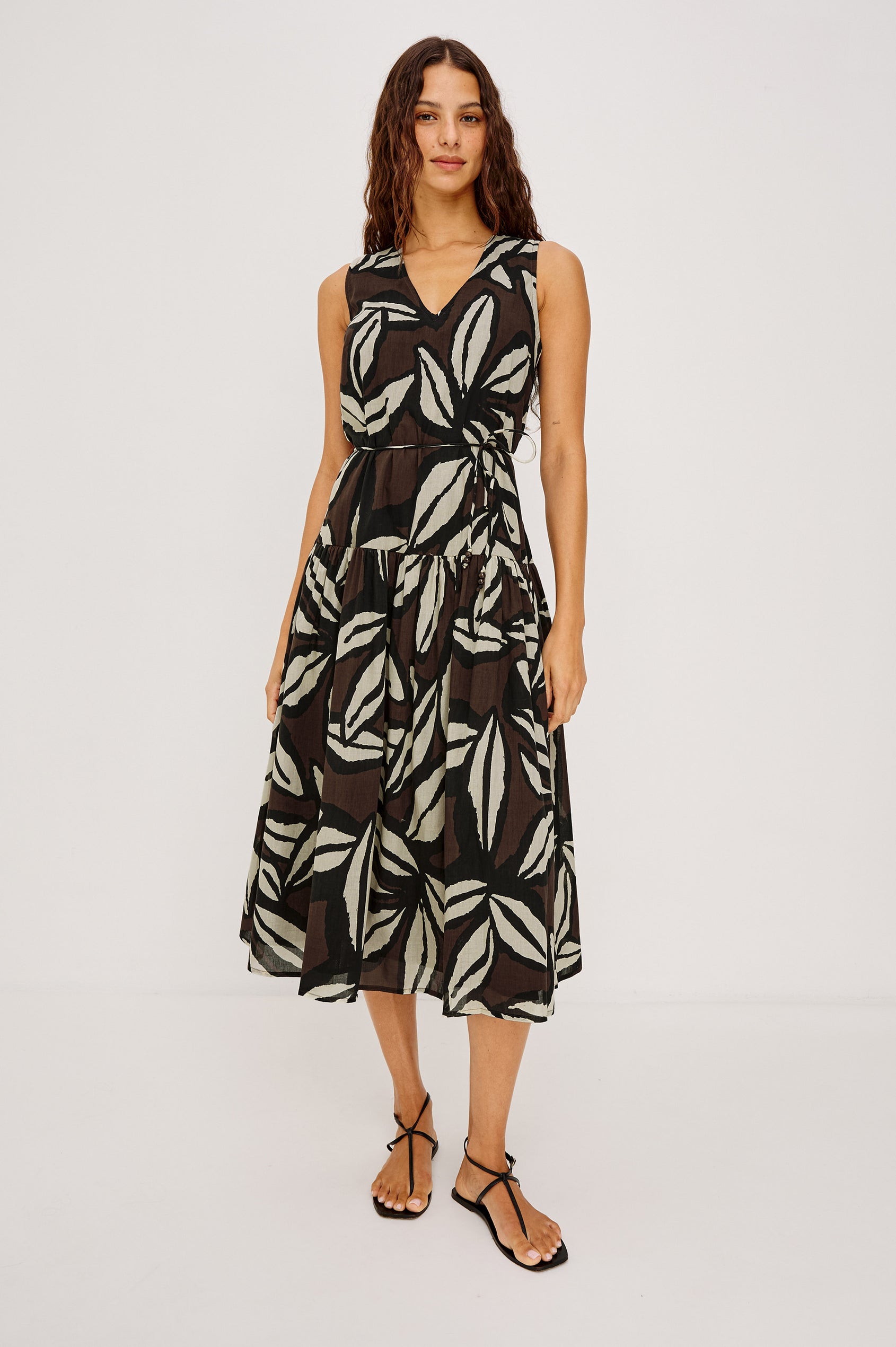 Maeve Midi Dress in Cotton Voile With V-Neckline, Adjustable Belted Ties, A-Line Silhouette, Drop Waist, Tiered Skirt, and Side Seam Zipper in Cocoa Floral Colorway - Full Body Front View Featured on Model