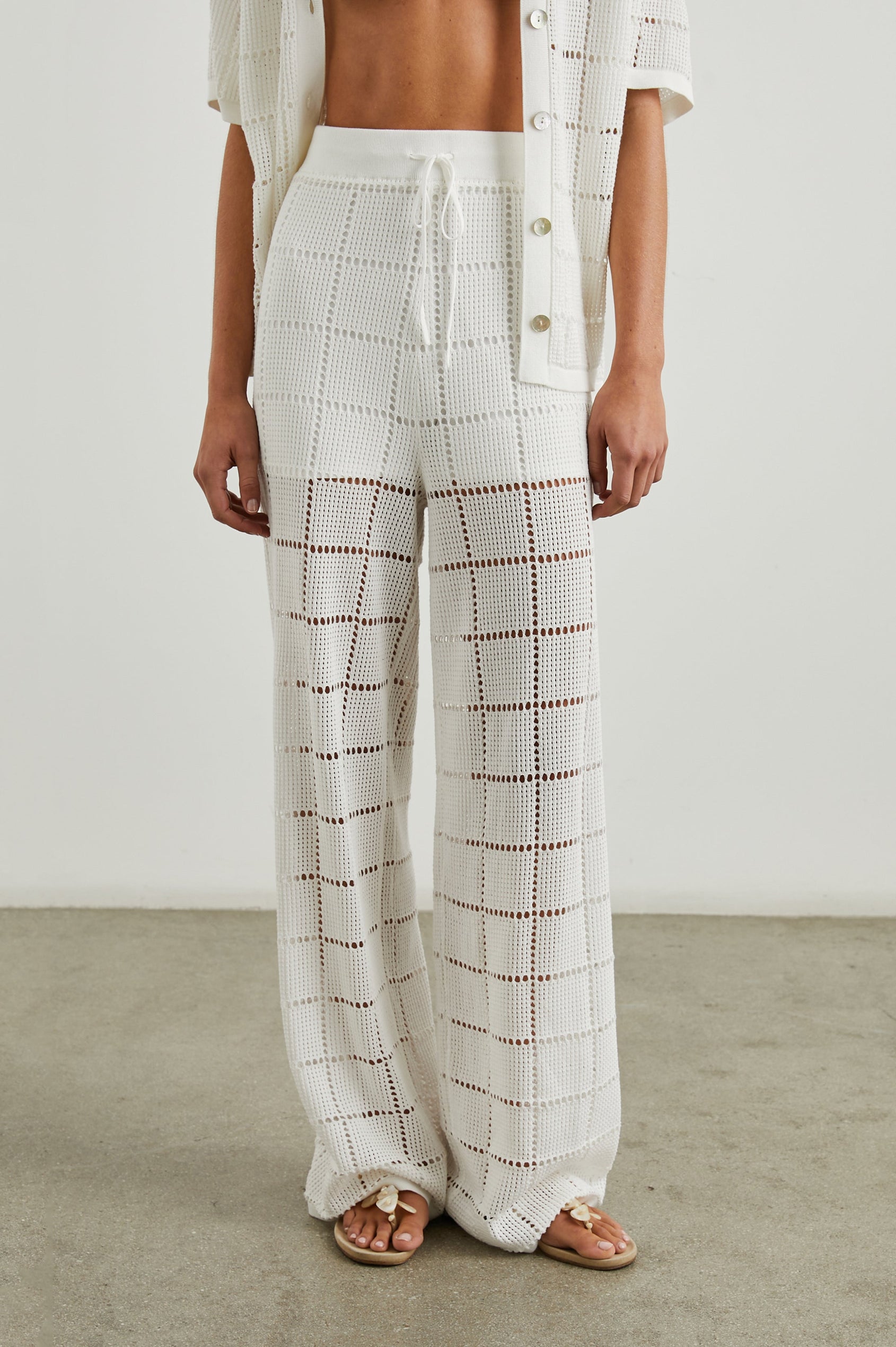 Maja Pants with a Drawstring Waist, an Open Stitch Grid Design, with a Shorts Underlayer in White Colorway - Front View Featured on Model 