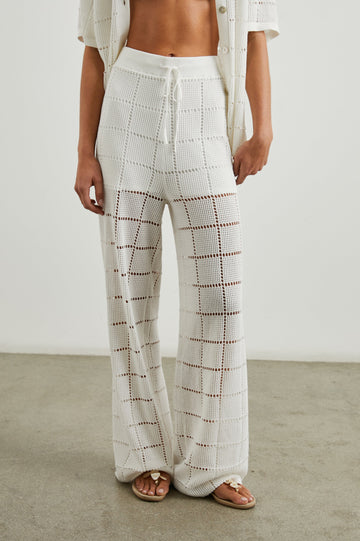 Maja Pants with a Drawstring Waist, an Open Stitch Grid Design, with a Shorts Underlayer in White Colorway - Front View Featured on Model 