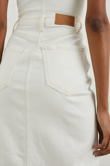 Malibu Sleeveless Denim Midi Dress with Shoulder Straps, Buttons Down the Front, a Square Neckline in the Front and Back, Two Front Pockets and Two Back Patch Pockets in Vintage Ecru Colorway - Back View Featured on Model