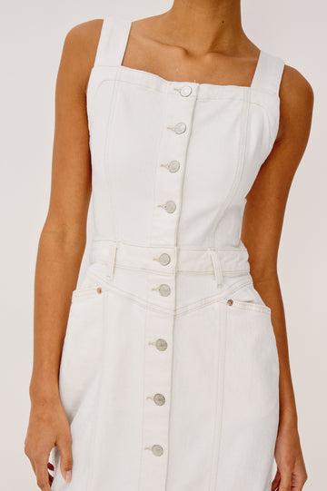 Malibu Sleeveless Denim Midi Dress with Shoulder Straps, Buttons Down the Front, a Square Neckline in the Front and Back, Two Front Pockets and Two Back Patch Pockets in Vintage Ecru Colorway - close up View Featured on Model