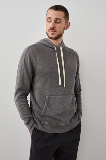 Mammoth Long-Sleeve Hoodie with a Kangaroo Pocket and Drawstring Hood in Washed Black Colorway - Front View Featured on Model