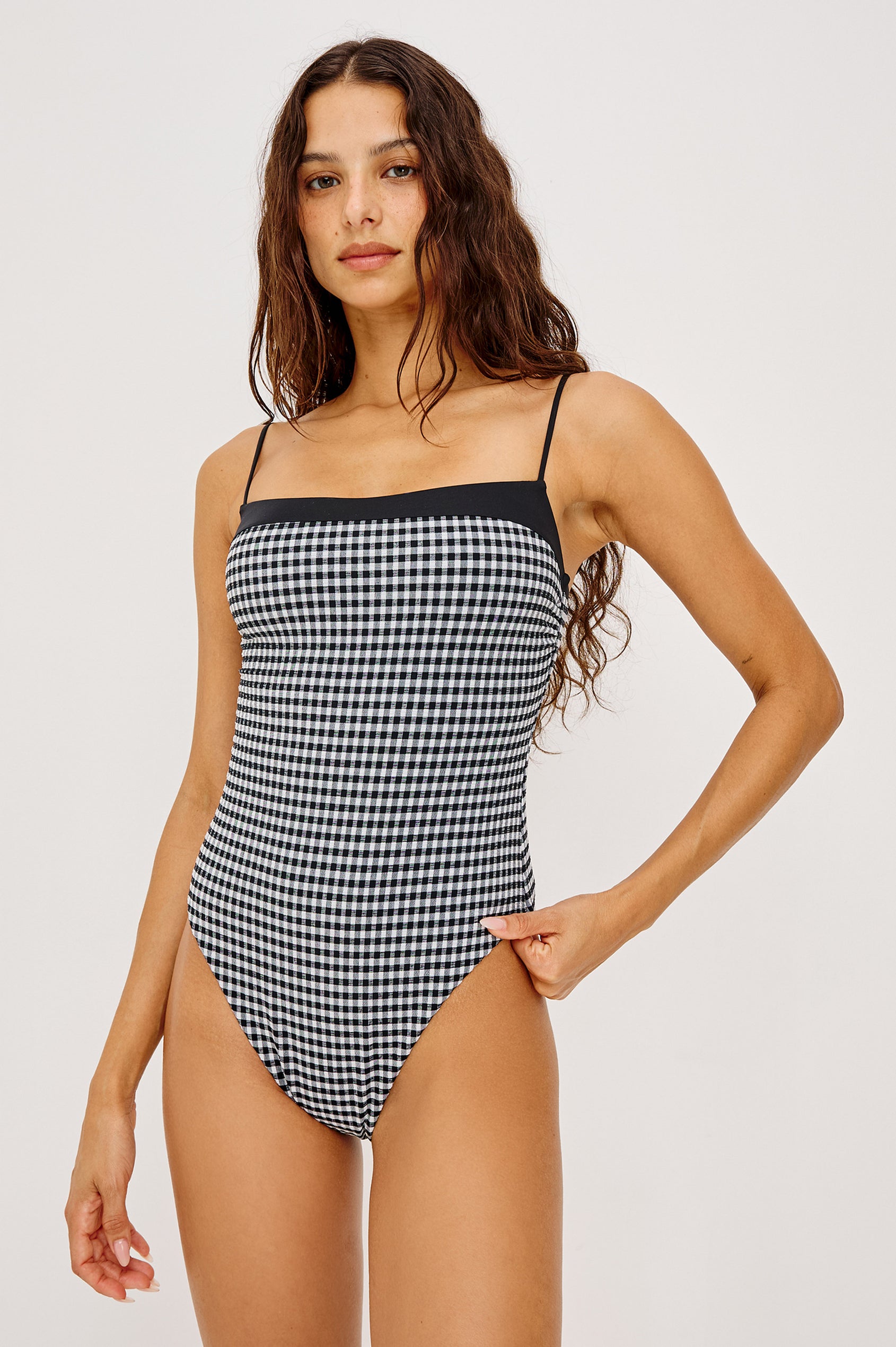 Marbella One Piece Swimsuit With Straight Neckline, Adjustable Shoulder Straps, and Classic Rear Coverage in Black White Gingham Colorway - Upper Body Front View Featured on Model