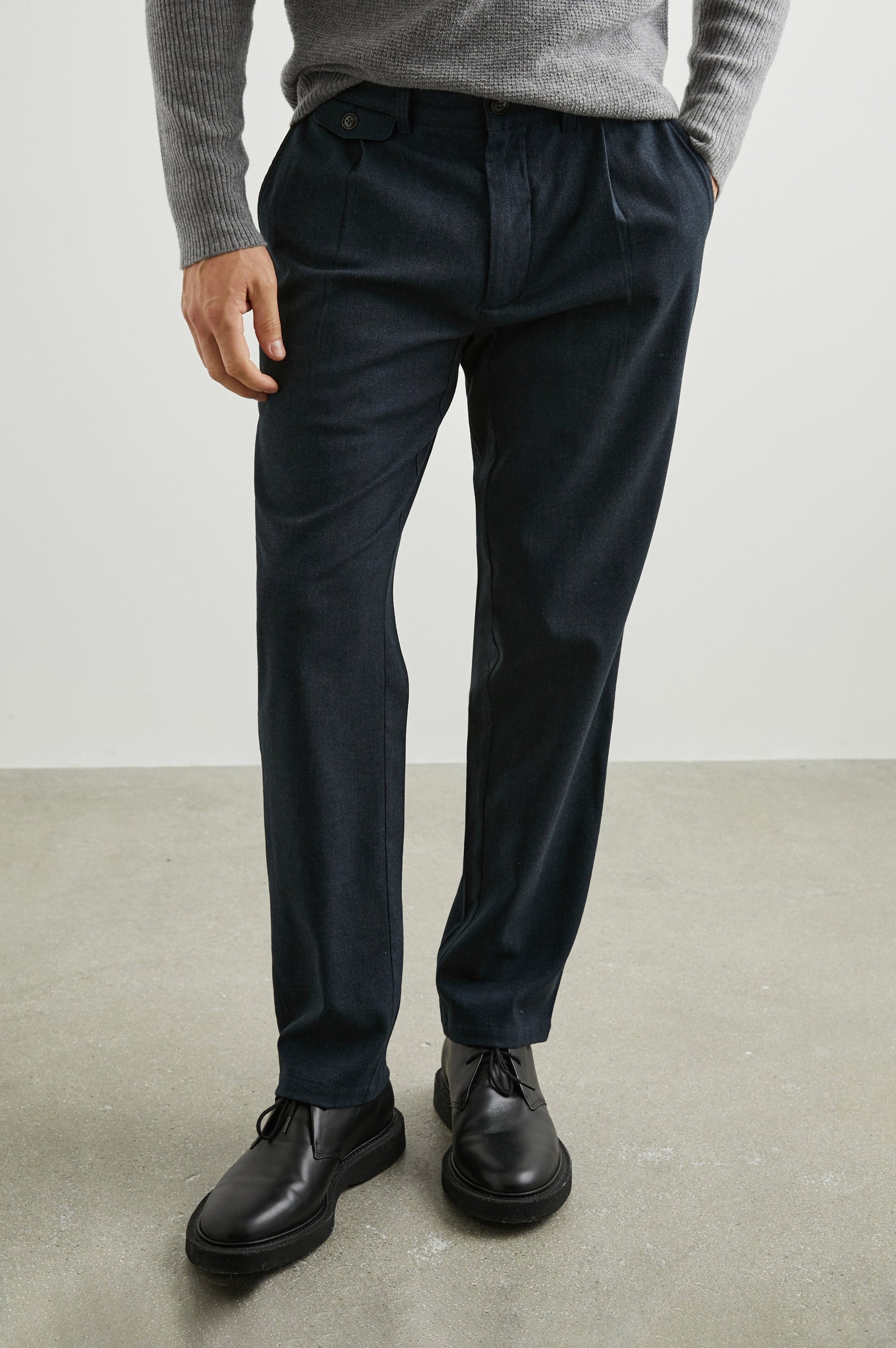 Marcellus Pants with Belt Loops, Two Seam Front Pockets, a Front Buttoned Flap Pocket, a Back Buttoned Welt Pocket and a Back Welt Pocket in Dark Navy Colorway - Front View Featured on Model 