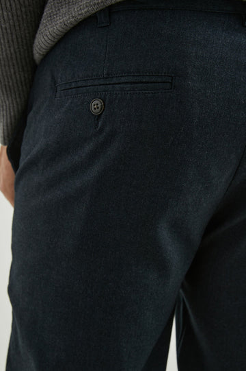 Marcellus Pants with Belt Loops, Two Seam Front Pockets, a Front Buttoned Flap Pocket, a Back Buttoned Welt Pocket and a Back Welt Pocket in Dark Navy Colorway - Back View Featured on Model 